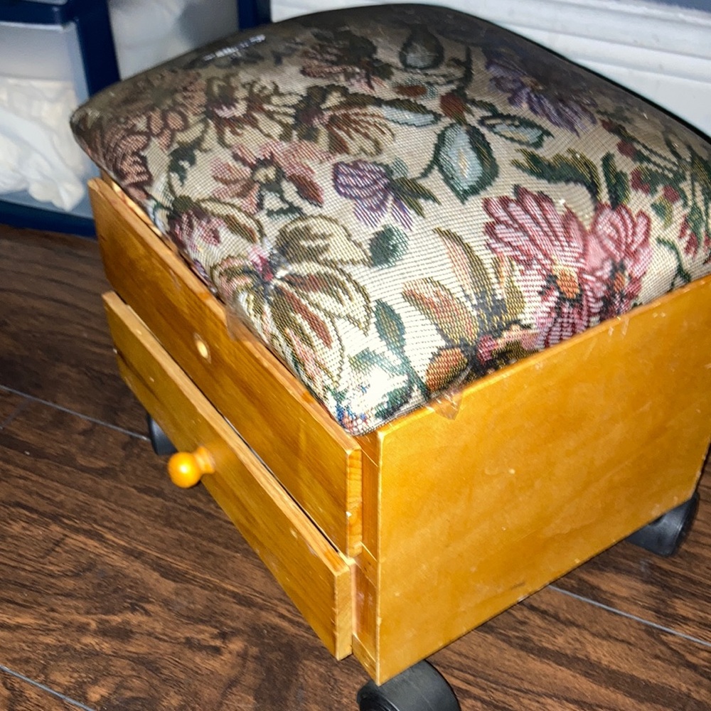A two drawer foot rest,it rolls